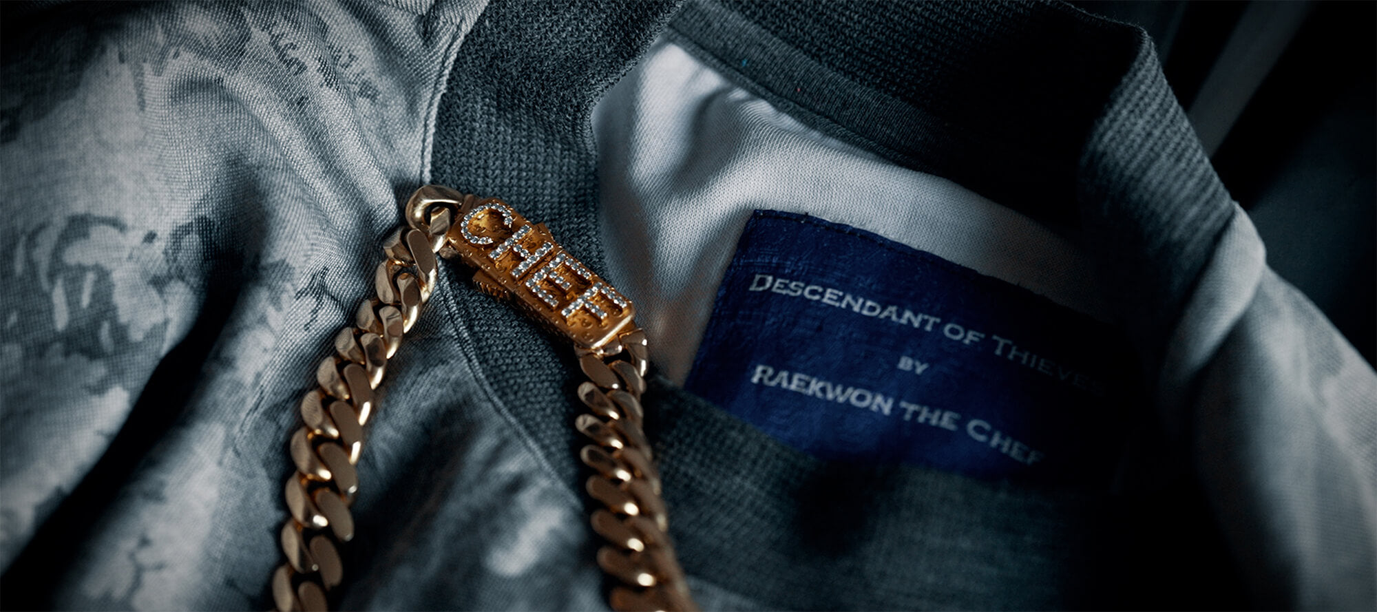 Descendant of Thieves collaboration with Raekwon of Wu-Tang Clan, showcasing a limited-edition menswear capsule blending streetwear and luxury fashion.